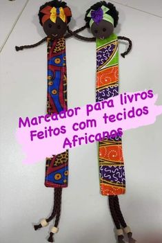 two colorful hair ties with faces on them and the words marroor para livros feitos con tecidos africaos