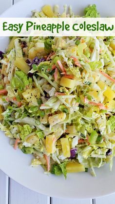 a white plate topped with a salad covered in lettuce and pineapple slices