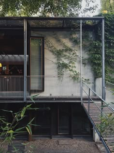 an exterior view of a house with stairs leading up to it