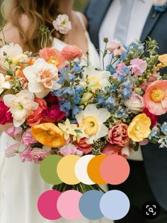 a bride and groom holding a bouquet of flowers in front of their wedding color scheme