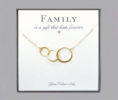 "Family of three eternity necklace with note card - Available In Gold, Rose Gold or 100% Sterling Silver A beautiful keepsake to show your family how much you love them! - Three circles are 24k gold vermeil or sterling silver (measuring about 32mm) - Chain is a shimmery 14k gold fill, rose gold fill or sterling silver chain - Total necklace length including circles shown at 19\" & 20\" -choose your favorite length - Necklace closes with a 14k gold fill, rose gold fill or sterling silver spri Elegant Circular Necklace For Mother's Day, Family Necklace Mother Jewelry, Personalized Round Symbolic Necklaces, Sterling Silver Circle Necklace For Mother's Day, Mother's Day Wedding Gift Jewelry: Round Pendant, Mothers And Daughters, Eternity Necklace, Three Necklaces, Couples Ring Set