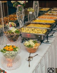 a buffet table filled with lots of food