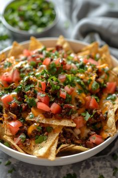 Loaded nachos topped with ground meat, melted cheese, tomatoes, and fresh cilantro. Air Fryer Dorito Nachos, Air Fryer Nachos With Meat, Nachos In Air Fryer, Air Fry Nachos, Nacho Airfryer, Strip Steak Recipe, Nachos Recipe, Air Fryer Healthy