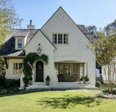 a white house with an american flag on the front door