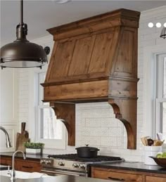 a kitchen with wooden cabinets and an island