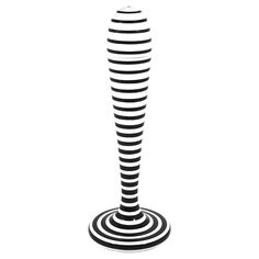 a black and white photo of a tall object with spirals on it's sides