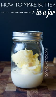 a jar filled with food sitting on top of a wooden table