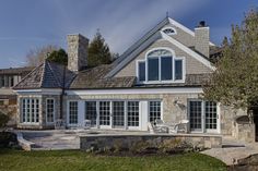 a large house with stone walls and windows