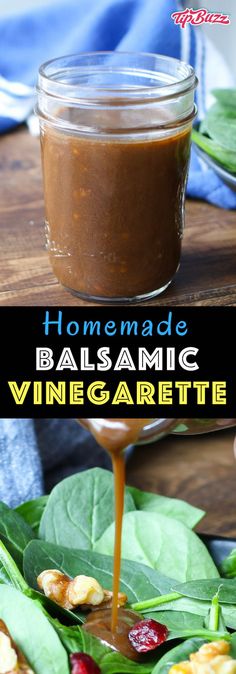 homemade balsamic vinegar sauce is being poured into a glass jar on top of spinach leaves