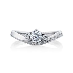 a white gold engagement ring with diamonds on it