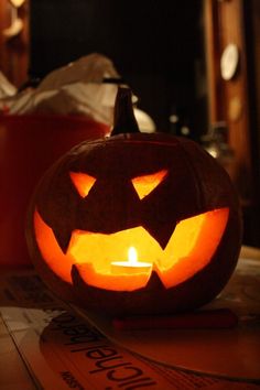 a carved pumpkin sitting on top of a table