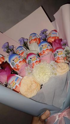 a bouquet of flowers and eggs in a box