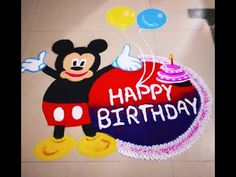 a mickey mouse birthday cake on the floor