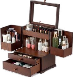 an open wooden makeup box with drawers