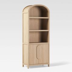 a wooden bookcase with an arched door on the front and bottom shelf, in light wood