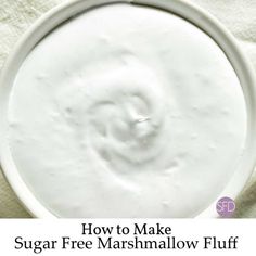 a bowl filled with sugar free marshmallow fluff on top of a white towel