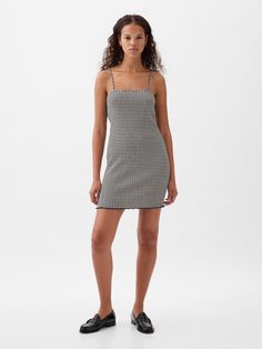 Soft, stretch mini dress.  Square neck.  Spaghetti straps.  Lettuce hem.  Allover gingham print.  Fit: Slim.  A slim silhouette that fits close to the body.  Hits above the knee.  Models wearing Gap Chic Summer Mini Dress By Gap, Casual Spaghetti Strap Dress By Gap, Fitted Sleeveless Mini Dress By Gap, Chic Houndstooth Mini Dress For Summer, Chic Gingham Mini Dress With Square Neck, Gap Fitted Mini Dress, Fitted Gingham Mini Dress With Square Neck, Gap Black Mini Dress For Summer, Gap Fitted Sleeveless Mini Dress