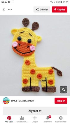 a crocheted giraffe is shown on the app