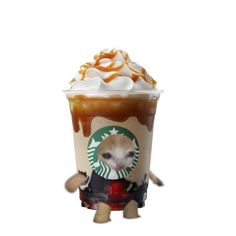 a starbucks drink with whipped cream, caramel and an animal figurine on top