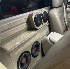 the interior of a car with speakers in it