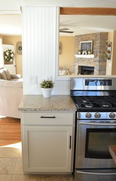 a stove top oven sitting inside of a kitchen