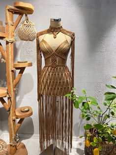 This stunning macrame dress is a show-stopper that is sure to turn heads at any party, festival, bachelorette celebration or bridal party. Handmade with care and precision, this dress is perfect for a bohemian-chic look that will make you feel confident and stylish. The macrame design is perfect for beachwear, making it a versatile choice for your next holiday or trip to the shore. Whether you're dancing the night away at a disco party or just want to show off your unique sense of style, this ma Caribbean Dress, Dark Tan Color, Macrame Clothes, Macrame Crochet, Look Boho Chic, Macrame Dress, Chain Dress, Estilo Hippie, Photoshoot Dress