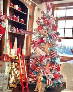 a christmas tree decorated with red, white and blue candy canes