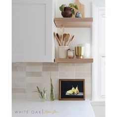 kitchen counter with wooden utensils on shelves above