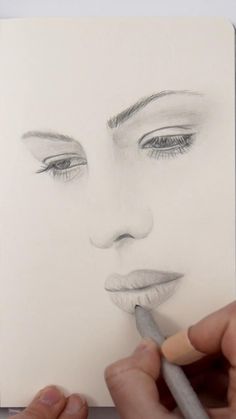 a drawing of a woman's face with a pencil