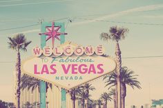 the welcome to fabulous las vegas sign in front of palm trees