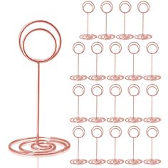 a metal rack with many circles on it and an object in the middle that is connected to each other