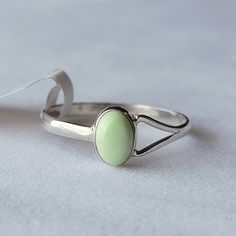 Sterling Silver Lemon Chrysoprase Ring Signed/Stamped Nj 925 925 Sterling Silver Genuine Gemstone Condition: New With Size Tag Dainty Split Shank Cabochon Size 7 See Mandrel Photo For Exact Sizing Lemon Chrysoprase Stimulates Dynamic 'Thinking Out Of The Box, And Meditation Can Facilitate Visions And A Deep Peaceful State. Lemon Chrysoprase Helps Harmonize Relationships, Stimulating Self Love And Passion. Lemon Chrysoprase Assists In Uncovering Deceitful Unconscious Thought. (Also Called Citron Green Sterling Silver Opal Ring For Promise, Green Oval Opal Ring In Sterling Silver, Silver Chrysoprase Cabochon Emerald Ring, Elegant Green Opal Ring In Sterling Silver, Elegant Green Turquoise Ring Stamped 925, Classic Silver Ring With Jade, Classic Silver Jade Ring, Silver Turquoise Ring With Cabochon Chrysoprase, Green Turquoise Ring For Gift