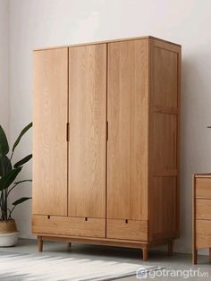 a large wooden cabinet sitting next to a plant in a living room with white walls