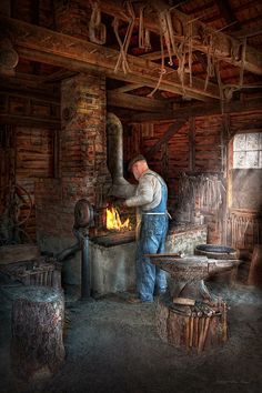 a man working in an old fashioned blacksmith