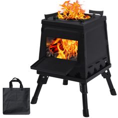 a black stove with flames in it and a tote bag