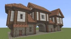 an old style house made out of bricks and stone with lots of windows on the front