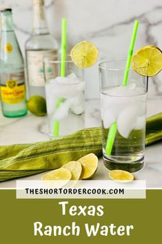 two glasses filled with water and lemons