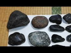 some rocks are sitting on top of a white board and there is no image here