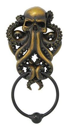 an octopus ring with a skull on it's face and tentacles attached to the handle