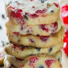 a stack of cookies with cranberry toppings sitting on top of each other