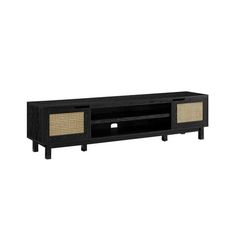 an entertainment unit with wicker doors and drawers on the bottom shelf, black finish