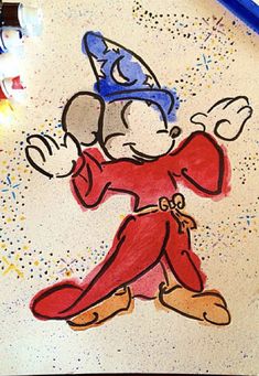 a drawing of mickey mouse on a piece of paper