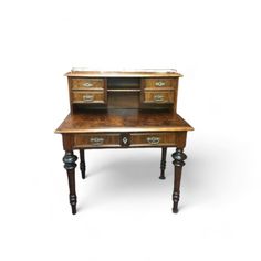 an old wooden desk with drawers on it