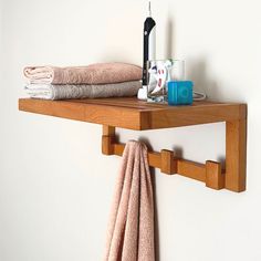 a shelf with towels, toothbrushes and other items on it