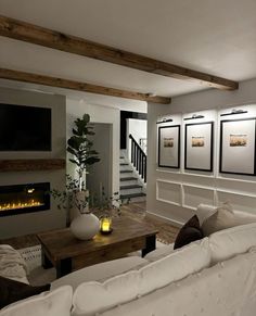 a living room filled with furniture and a fire place