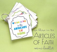 four cards with the words we believe in the articles of faith on them and a keychain