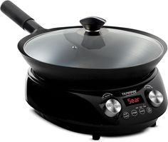 an electric skillet with a glass lid on the top and timers on the side