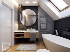 a bath room with a tub a sink and a mirror on the wall in it