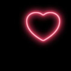 a heart shaped neon sign on a black background with the word love written below it