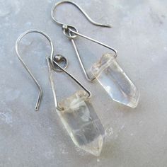 Healing Quartz Crystal Dangling Earrings Clear Gemstone Drops: These rectangle hoop earrings are hand made out of hammered sterling silver and natural polished clear Quartz crystal points. They measure about 2" total length by approximately 1/2" wide. 100% hand made by myself in my little home studio.  Enter my shop: https://www.etsy.com/shop/artdi Join me on Facebook: https://www.facebook.com/Artdi-Diana-Anton-Jewelry-Design-44805607932/ Find me on Instagram: https://www.instagram.com/dianaantonjewelrydesign/ Crystal Point Earrings, Diy Dangling Earrings, Rectangle Hoop Earrings, Raw Quartz, Jewellery Inspiration, Handmade Jewelry Tutorials, Diy Crystals, Hammered Sterling Silver, Dangling Earrings